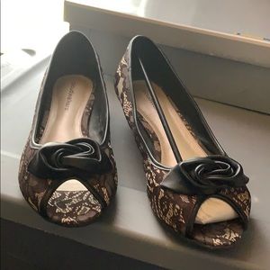 Gently used peep toe one inch heels.